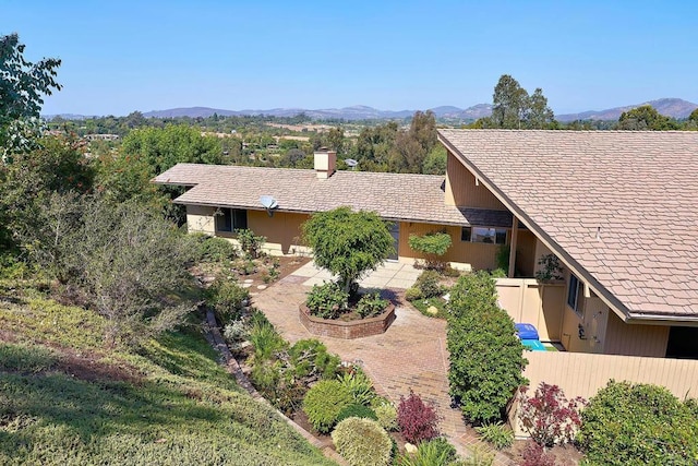 birds eye view of property with a mountain view