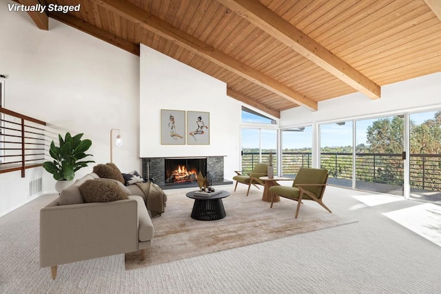 sunroom with lofted ceiling with beams and wood ceiling