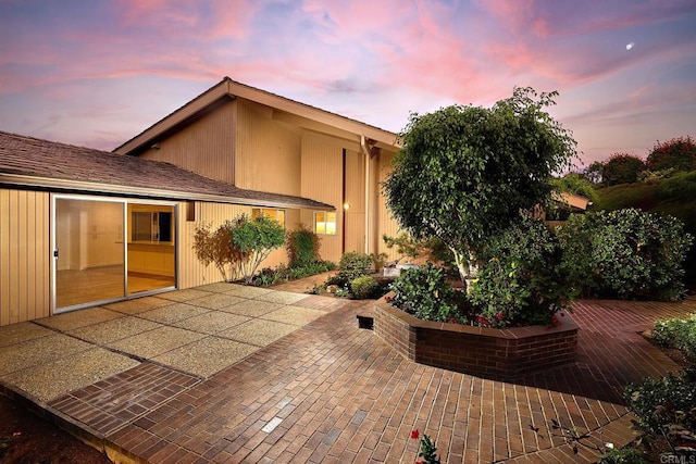 view of patio terrace at dusk