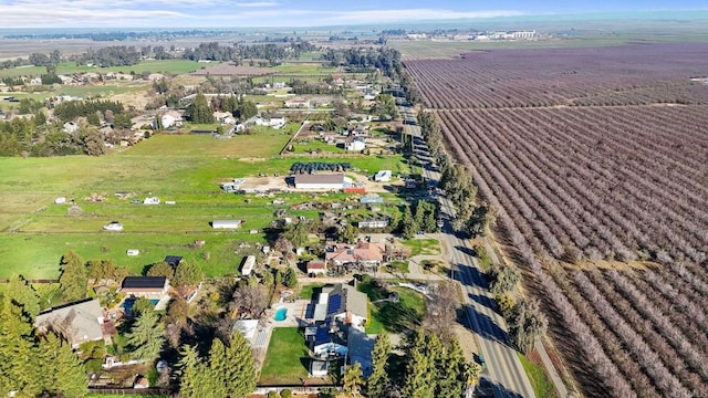 birds eye view of property with a rural view