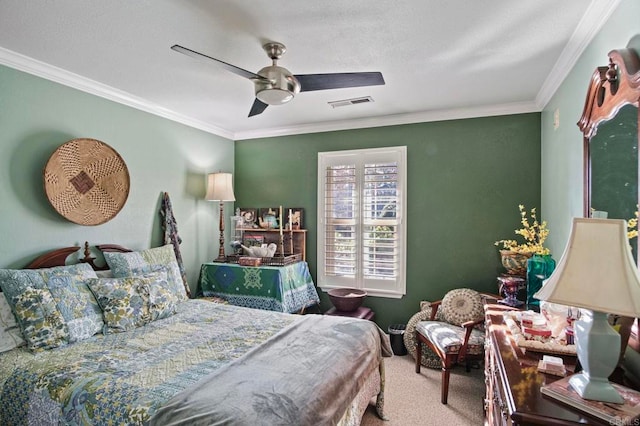 carpeted bedroom featuring ceiling fan and ornamental molding