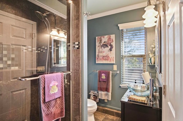 bathroom featuring toilet, vanity, ornamental molding, and walk in shower