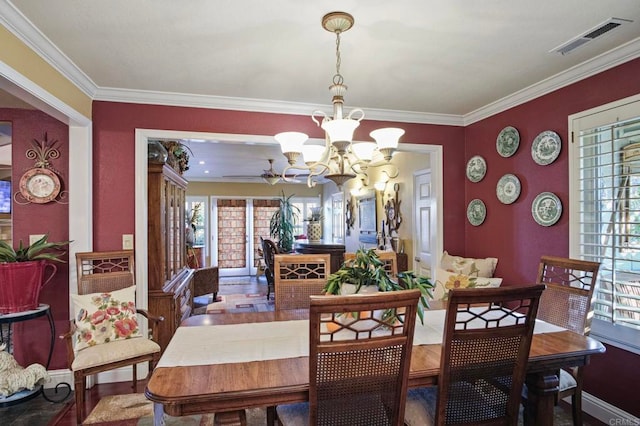 dining room with an inviting chandelier and crown molding