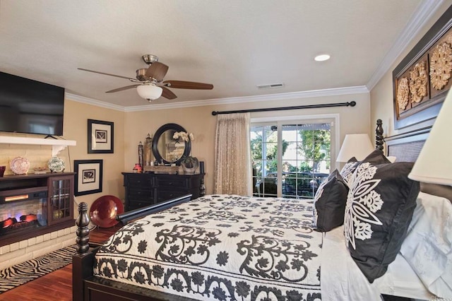 bedroom with access to exterior, ceiling fan, wood-type flooring, and ornamental molding