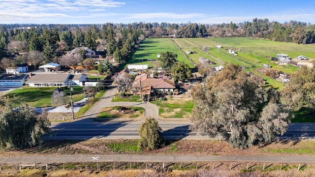 birds eye view of property featuring a rural view