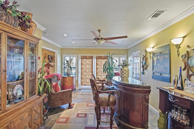 bar featuring crown molding and ceiling fan