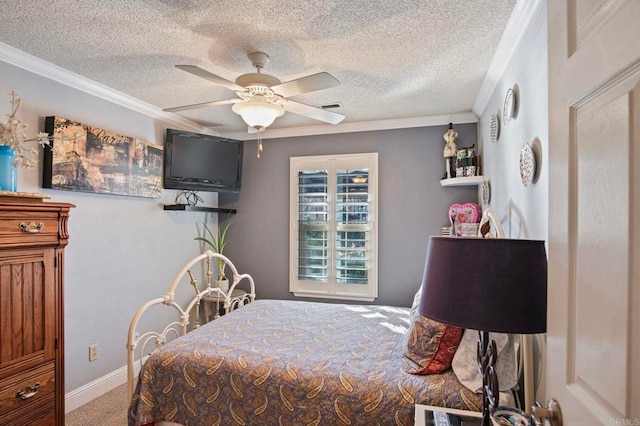 carpeted bedroom with ceiling fan, crown molding, and a textured ceiling