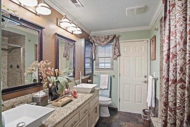 bathroom with vanity, crown molding, a shower, and toilet