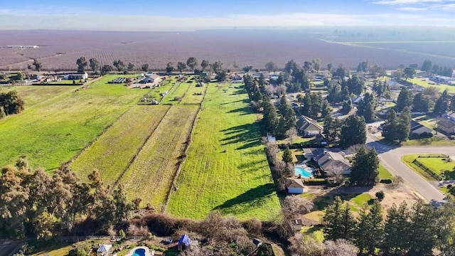 birds eye view of property featuring a rural view