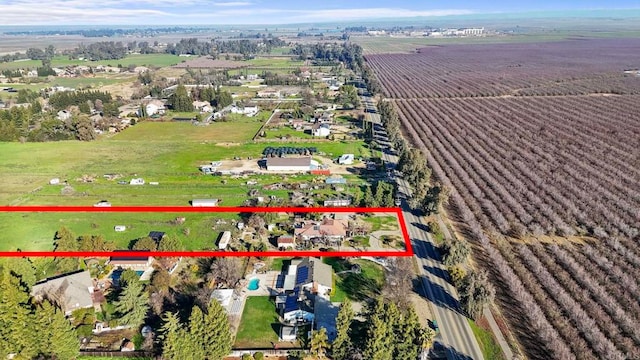 birds eye view of property featuring a rural view