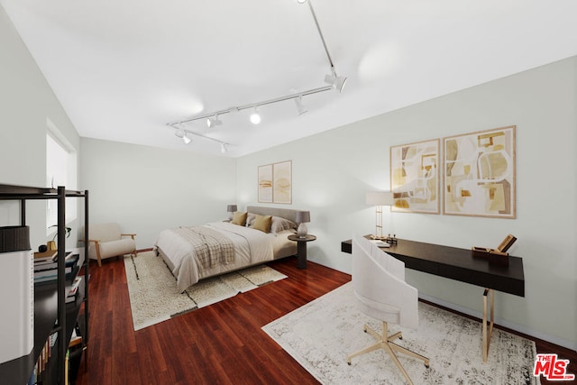 bedroom with hardwood / wood-style floors