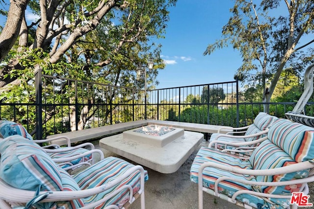 view of patio / terrace featuring a fire pit