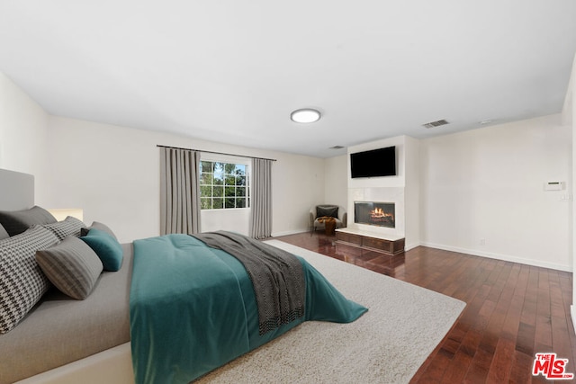 bedroom featuring dark hardwood / wood-style flooring