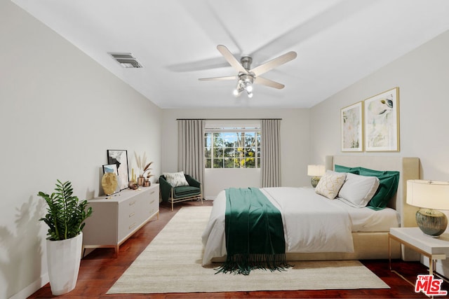 bedroom featuring ceiling fan and dark hardwood / wood-style flooring