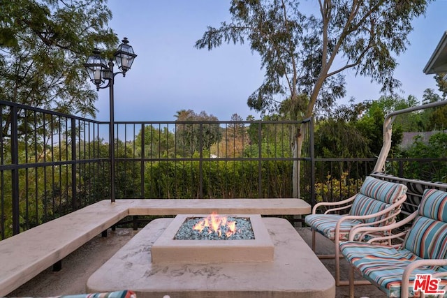 view of patio / terrace with an outdoor fire pit