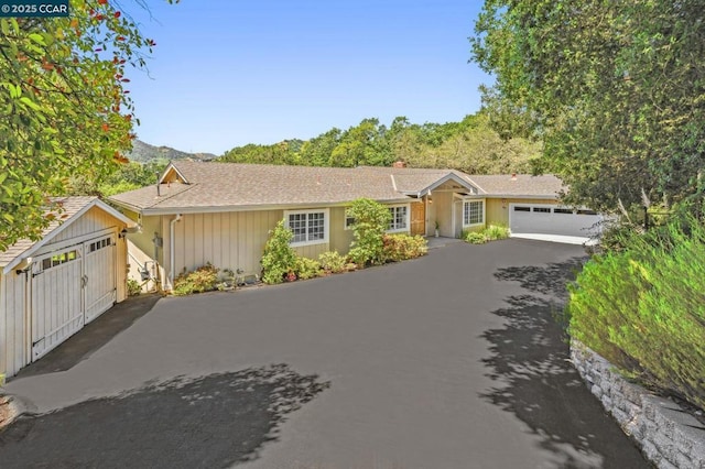 ranch-style home featuring a garage