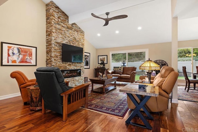 living room with a stone fireplace, high vaulted ceiling, beamed ceiling, hardwood / wood-style flooring, and ceiling fan