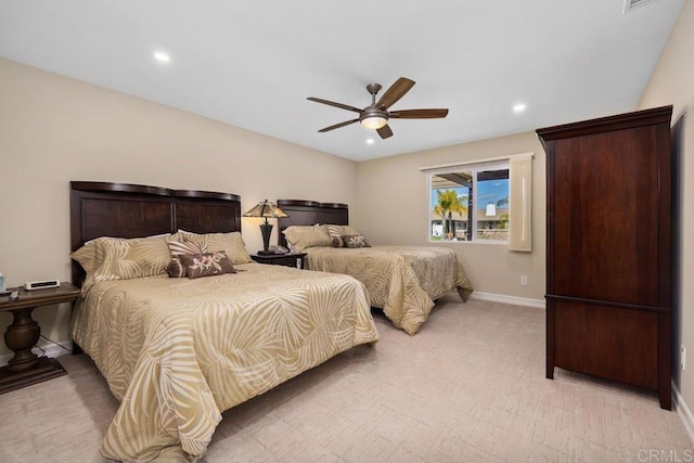 bedroom featuring light carpet and ceiling fan