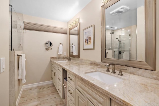 bathroom with walk in shower and vanity