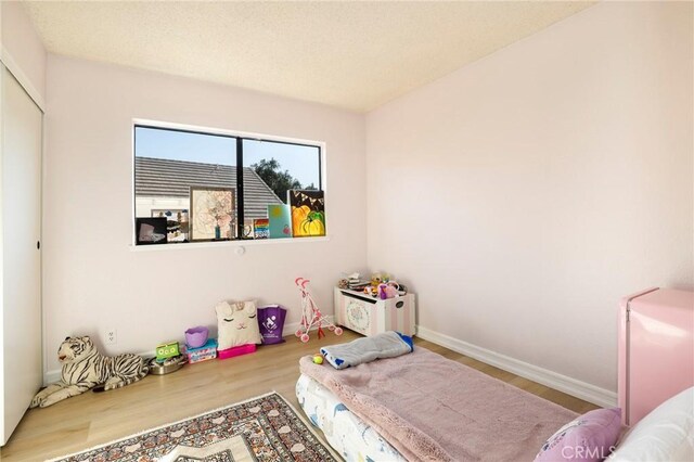 bedroom with light hardwood / wood-style flooring