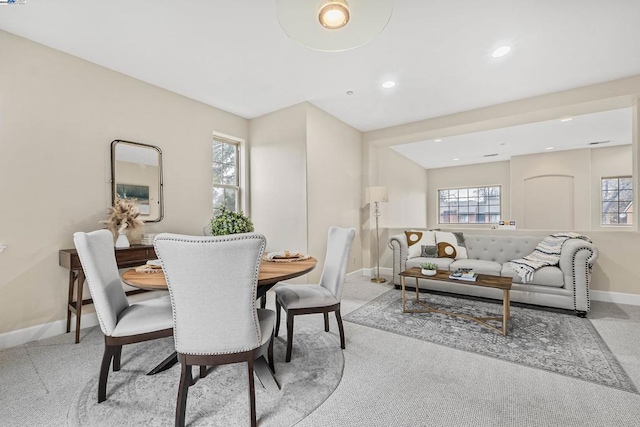 dining space with light carpet