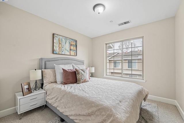 bedroom featuring light carpet