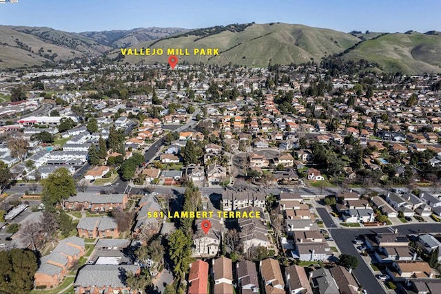 drone / aerial view featuring a mountain view