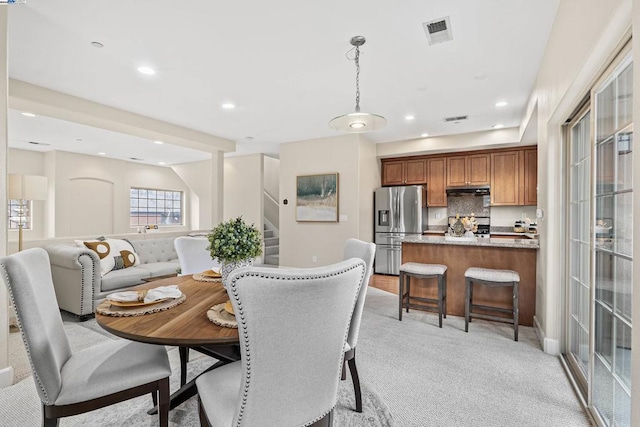 view of carpeted dining space