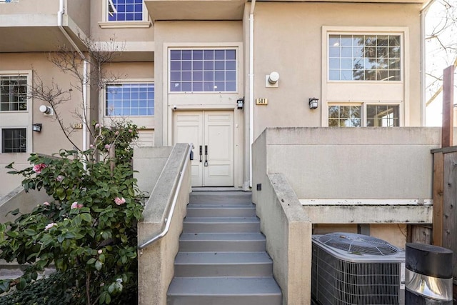 view of exterior entry featuring cooling unit