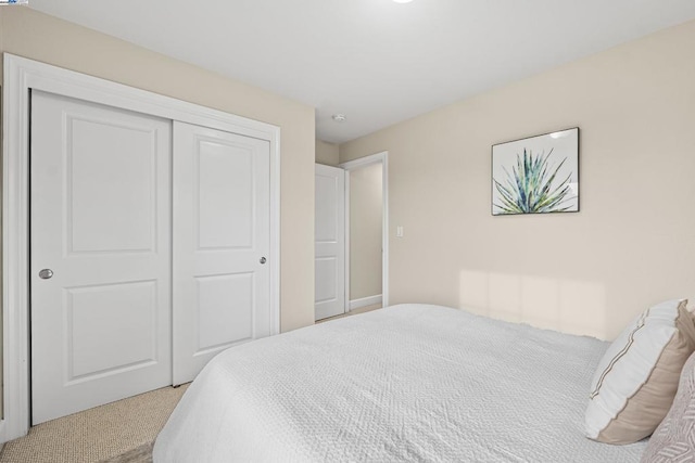 carpeted bedroom with a closet