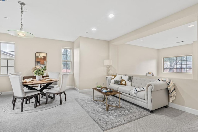 living room featuring light colored carpet