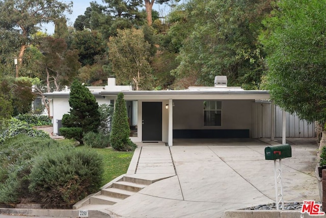 view of front of home with a carport