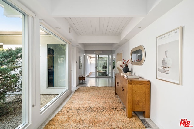 corridor featuring beamed ceiling