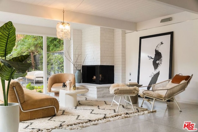 sitting room with a notable chandelier and beamed ceiling