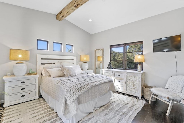 bedroom featuring lofted ceiling with beams