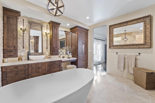 bathroom with vanity and a washtub