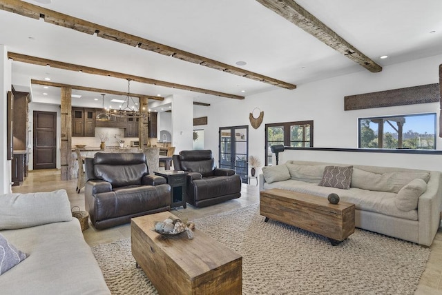 living room featuring a notable chandelier and beamed ceiling