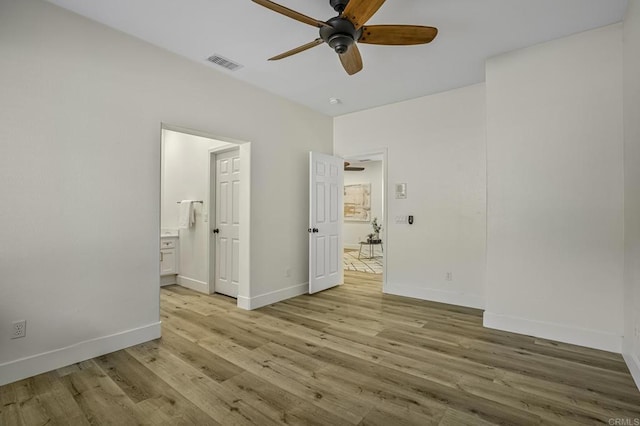 unfurnished bedroom featuring visible vents, baseboards, and light wood finished floors