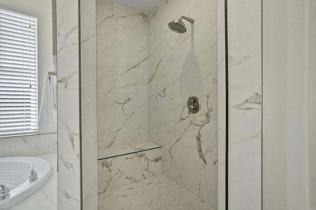 full bathroom with a bath and a marble finish shower