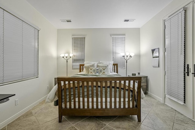 bedroom with visible vents and baseboards