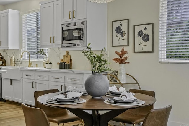 dining space featuring light wood-style flooring