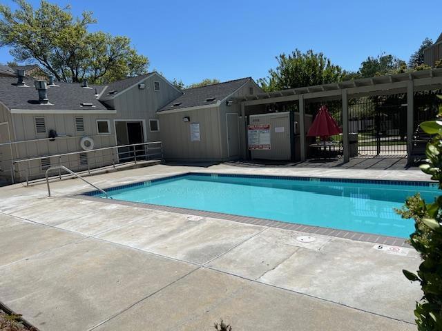 view of swimming pool with a patio area