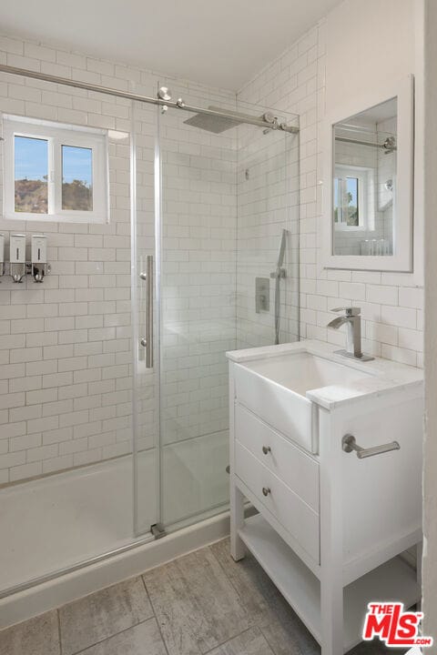 bathroom featuring vanity and walk in shower