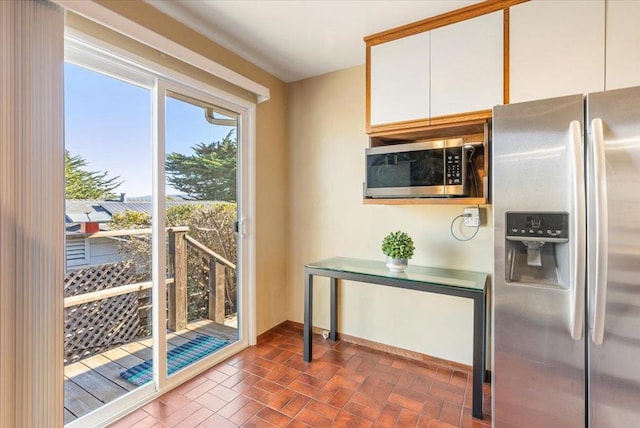 kitchen featuring white cabinets and stainless steel appliances