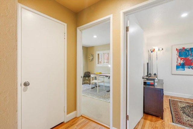 hallway with light wood-type flooring