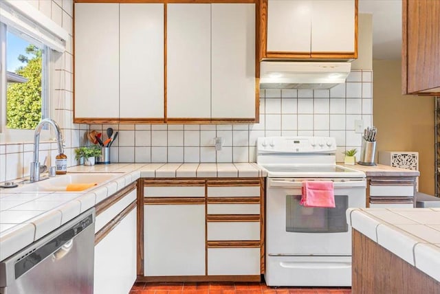 kitchen featuring white cabinets, dishwasher, electric range, and extractor fan