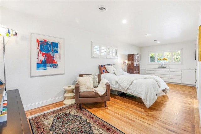 bedroom with light hardwood / wood-style flooring