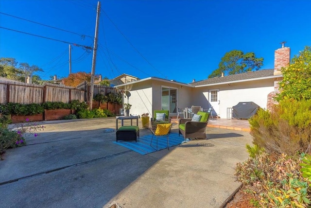 rear view of house featuring a patio area