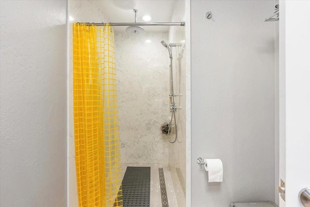 bathroom featuring walk in shower