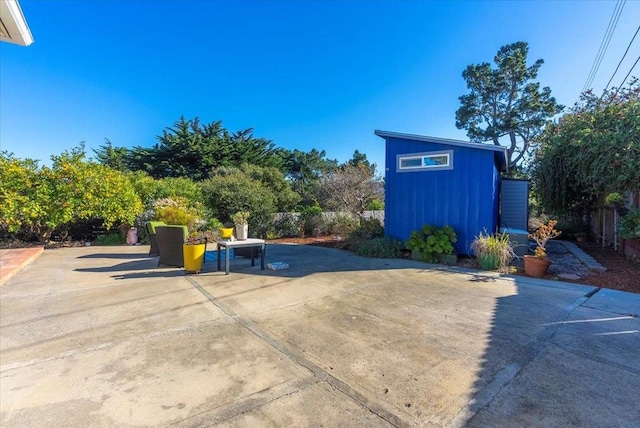 view of patio / terrace with a storage shed